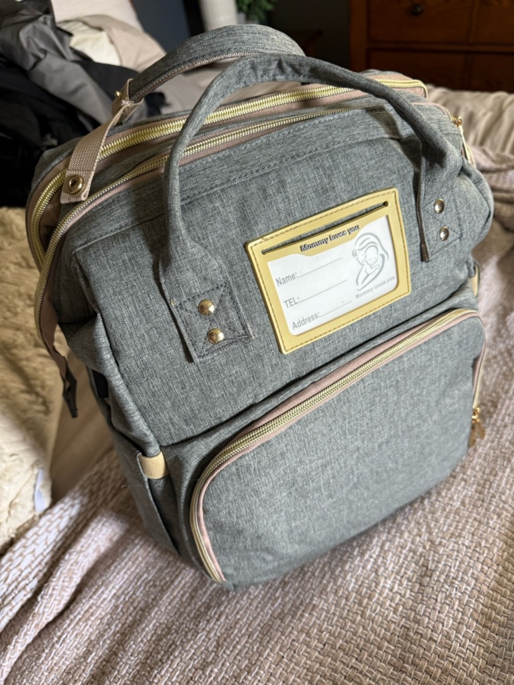 NWOT Gray diaper bag Backpack with Gold Trim, included NEW changing pad & expand
